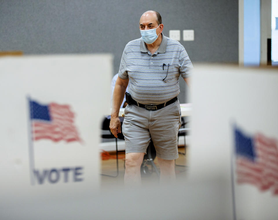 Jim Sencindiver casts his ballot in the Republican primary at the Dorothy Hart Community Center in Fredericksburg, Va., on Tuesday, June 21, 2022. (Tristan Lorei/The Free Lance-Star via AP)