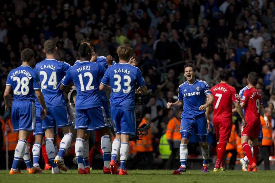 Chelsea's Frank Lampard, centre right, celebrates with teammates as his team beat Liverpool 2-0 in their English Premier League soccer match against Liverpool at Anfield Stadium, Liverpool, England, Sunday April 27, 2014. (AP Photo/Jon Super)