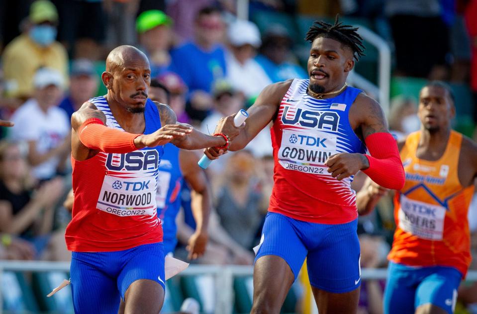 Team USA’s Elija Godwin hands off the baton to teammate Vernon Norwood in the first round of the men’s 4x400 meter relay Saturday, July 23, 2022 at the World Athletics Championships at Hayward Field in Eugene, Ore.