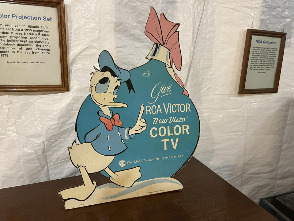 An advertisement featuring Donald Duck appears among the collection of televisions at the Early Television Museum in Hilliard, Ohio on June 4, 2023. The museum features a large collection of televisions from the 1920s and 1930s. It also has scores of the much-improved, post-World War II, black-and-white sets that changed the entertainment landscape. Disney helped RCA sell color television sets after they were introduced in 1954. (Steve Wartenberg via AP)