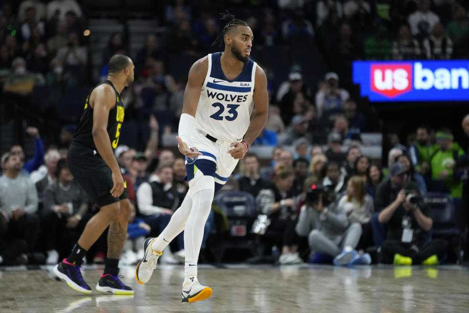 Minnesota Timberwolves forward Troy Brown Jr. (23) gestures after making a basket against the Uah Jazz during the first half of an NBA basketball game Thursday, Nov. 30, 2023, in Minneapolis. (AP Photo/Abbie Parr)