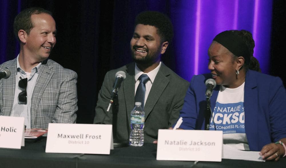 Jason Kyle Holic, from left, Maxwell Frost, and Natalie Jackson are pictured during “Decision 2022 Community Conversations With Congressional Candidates” panel discussion at the Orlando Science Center on Thursday, July 28, 2022, in Orlando, Fla. Frost, who campaigned on gun control, Medicare for all and criminal justice reform, beat out a crowded cast of Democrats who ran for Florida’s 10th Congressional District, an Orlando area seat considered to be a liberal stronghold. (Stephen M. Dowell/Orlando Sentinel via AP)