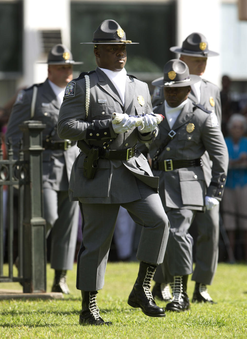 An honor guard from the South Carolina Highway patrol removes the Confederate battle flag from the Capitol grounds Friday, July 10, 2015, in Columbia, S.C. 