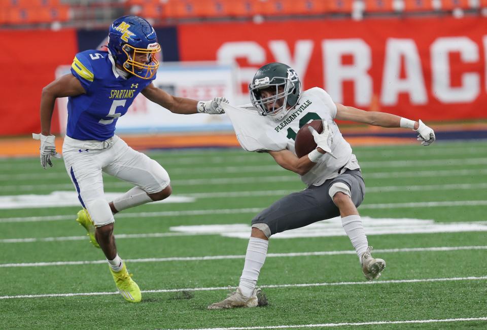 Maine-Endwell  Donavin Hamer (5) tries to tackle  Pleasantville's Erik Coleman (13) during the Class B state football championship game in the Carrier Dome at Syracuse University Dec 4, 2021. Maine-Endwell won the game 21-12.