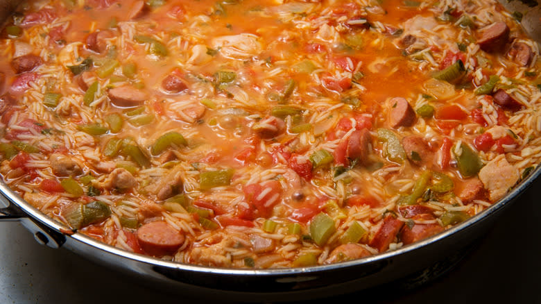 Jambalaya with sausage and chicken cooking