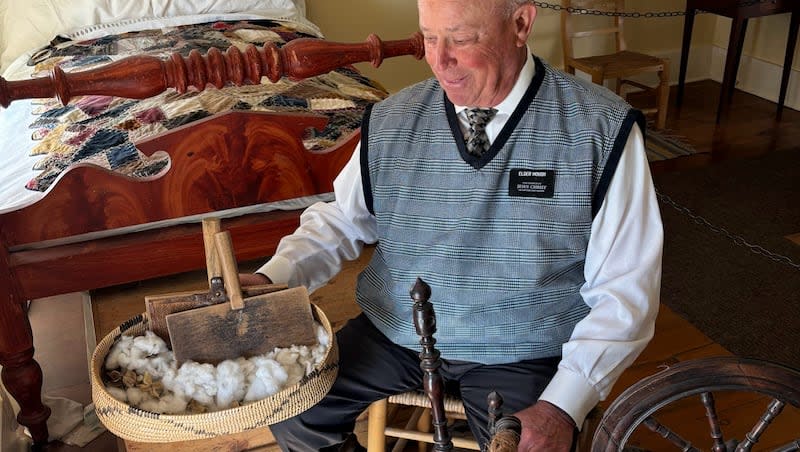 Stan Hough, a missionary at the Brigham Young Home in St. George, shows off cotton that was grown on site. Each year, a small garden is planted with cotton, hearkening back to the reason "Utah's Dixie" was settled in the 1860s.