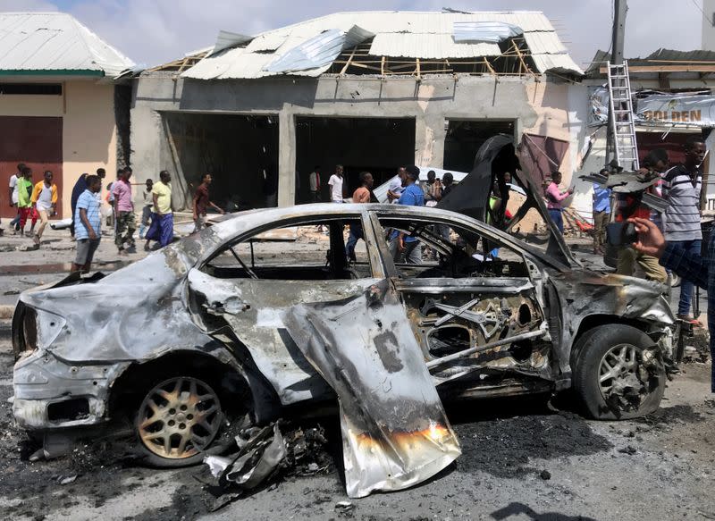 The wreckage of a car is seen at the scene of a bomb explosion in Mogadishu