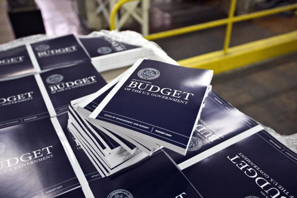 FILE - In this April 8, 2013, file photo, copies of President Barack Obama's budget plan for fiscal year 2014 are prepared for delivery at the U.S. Government Printing Office in Washington. Just four years ago, deficits and debt were an explosive political combination, propelling Republicans to control of the House and fueling the budget fights that would ensue over the next three years. Today, they are an afterthought _ a dying ember in Washington’s political and policy landscape. (AP Photo/J. Scott Applewhite, File)