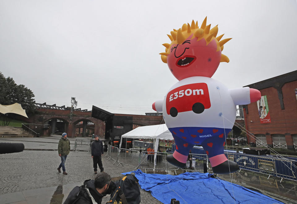 A blimp of Britain's Prime Minister Boris Johnson is inflated as part of the Reject Brexit defend our democracy protest, before the Conservative party conference in Manchester, England, Sunday, Sept. 29, 2019. British Prime Minister Boris Johnson says he has "no interest to declare" in his links to an American businesswoman who allegedly received favorable treatment because of their friendship during his time as mayor of London. (Peter Byrne/PA via AP)