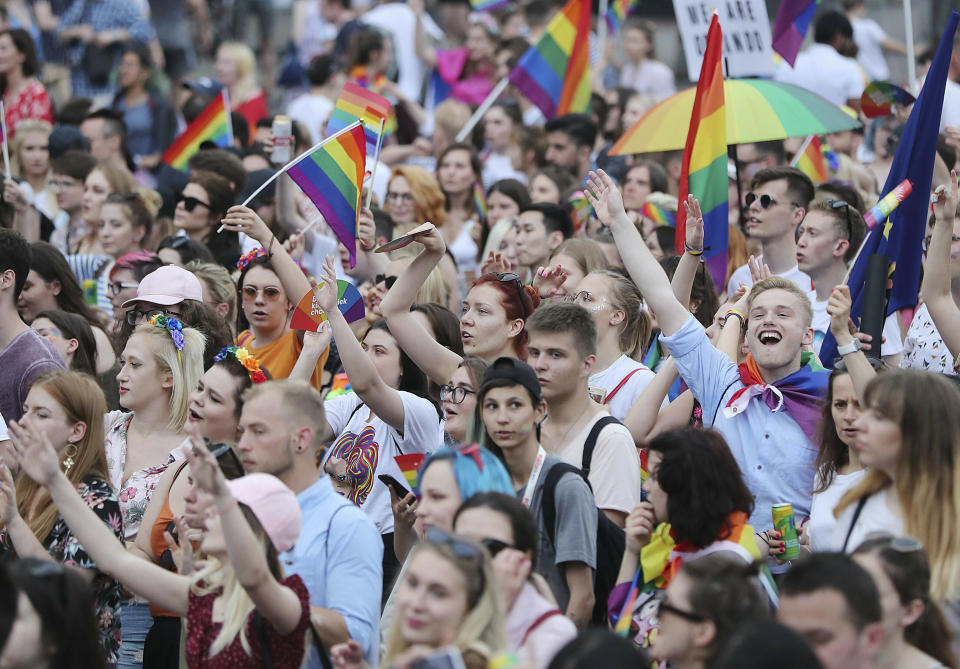 People take part in a gay pride parade in Warsaw, Poland, on Saturday, June 8, 2019. The Equality Parade is the largest gay pride parade in central and Eastern Europe. It brought thousands of people to the streets of Warsaw at a time when the LGBT rights movement in Poland is targeted by hate speeches and a government campaign depicting it as a threat to families and society. (AP Photo/Czarek Sokolowski)