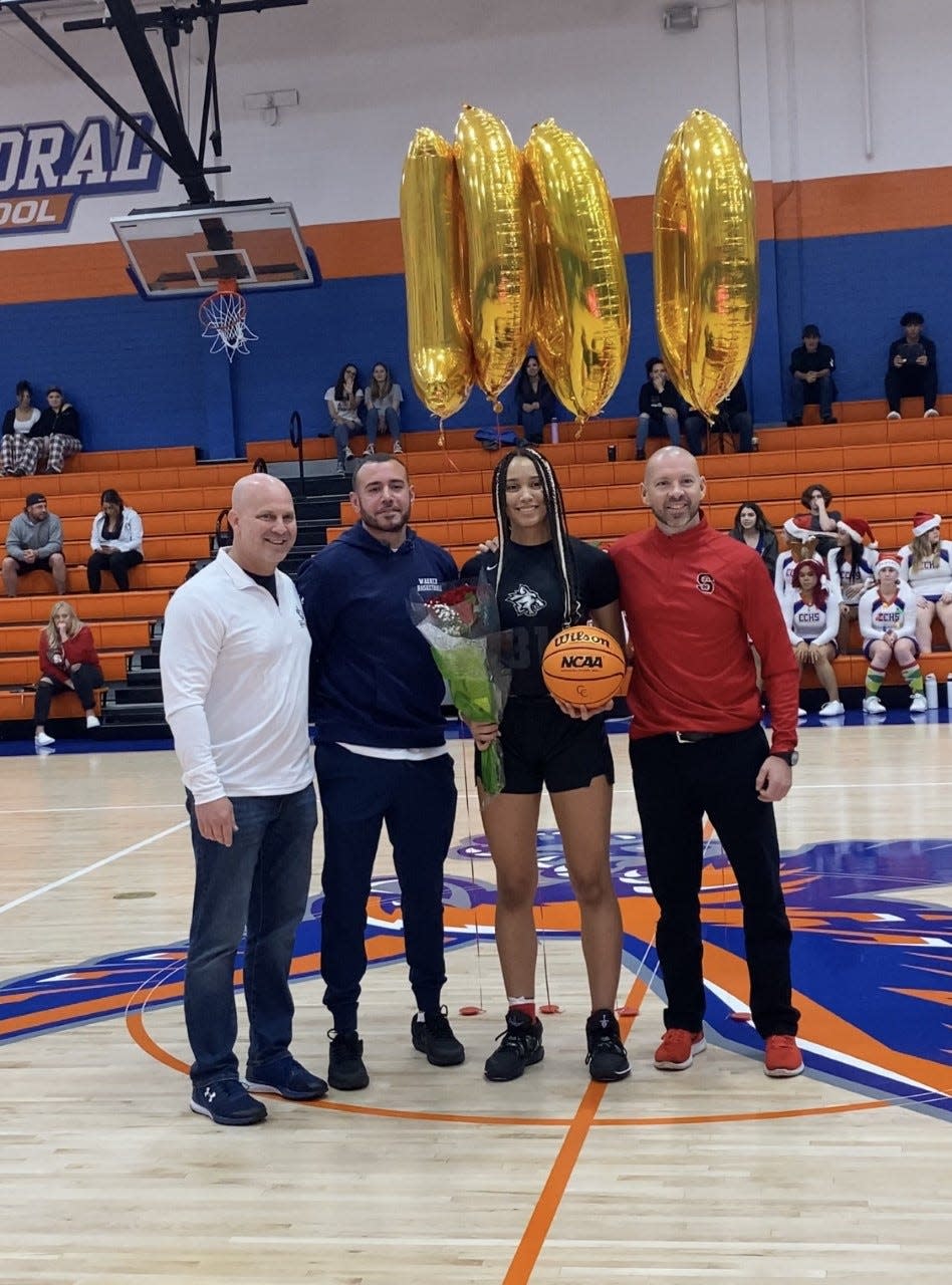 South Fort Myers senior Haley Lang poses after scoring her 1,000th career point