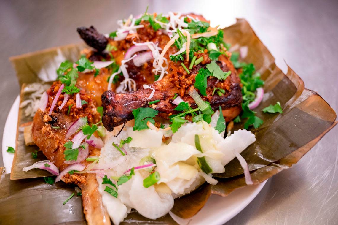 The combination plate from Theary Cambodian Foods at Spice Bridge in Tukwila features stuffed chicken wings, fragrant with lemongrass and sprinkled with toasted coconut, cilantro and pickled radishes.