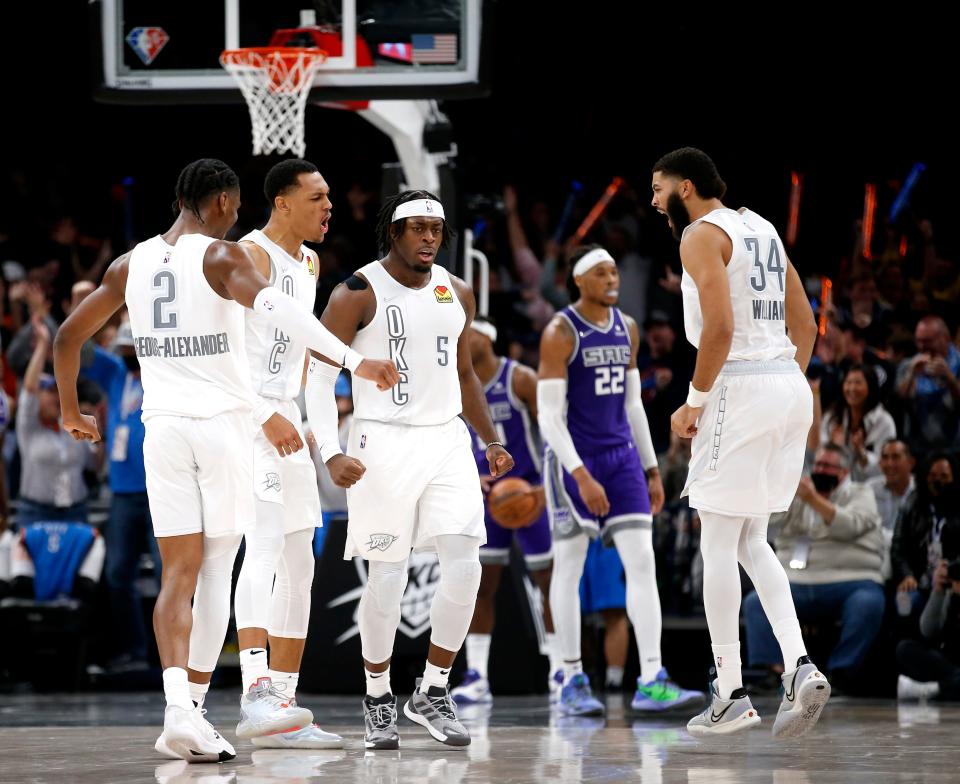 Oklahoma City's Shai Gilgeous-Alexander (2), Darius Bazley (7), Luguentz Dort (5) and Kenrich Williams (34) celebrate in front of Sacramento's Richaun Holmes (22) on Nov. 12.