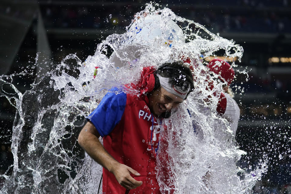 Philadelphia Phillies' Orion Kerkering is dunked after a baseball game against the New York Mets, Sunday, Sept. 24, 2023, in Philadelphia. (AP Photo/Matt Slocum)