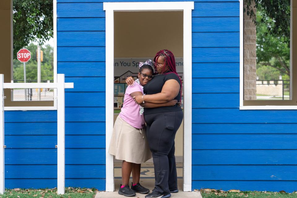 Bailee Smith, 10, hugs her mom, Errin Smith, at the Play for All Park in Round Rock. In February, Bailee, who has had Medicaid since Smith was pregnant with her, became one of the 2.1 million people who have lost Medicaid coverage in Texas. Now, the family also faces the loss of their preferred Medicaid and CHIP provider, Superior HealthPlan.