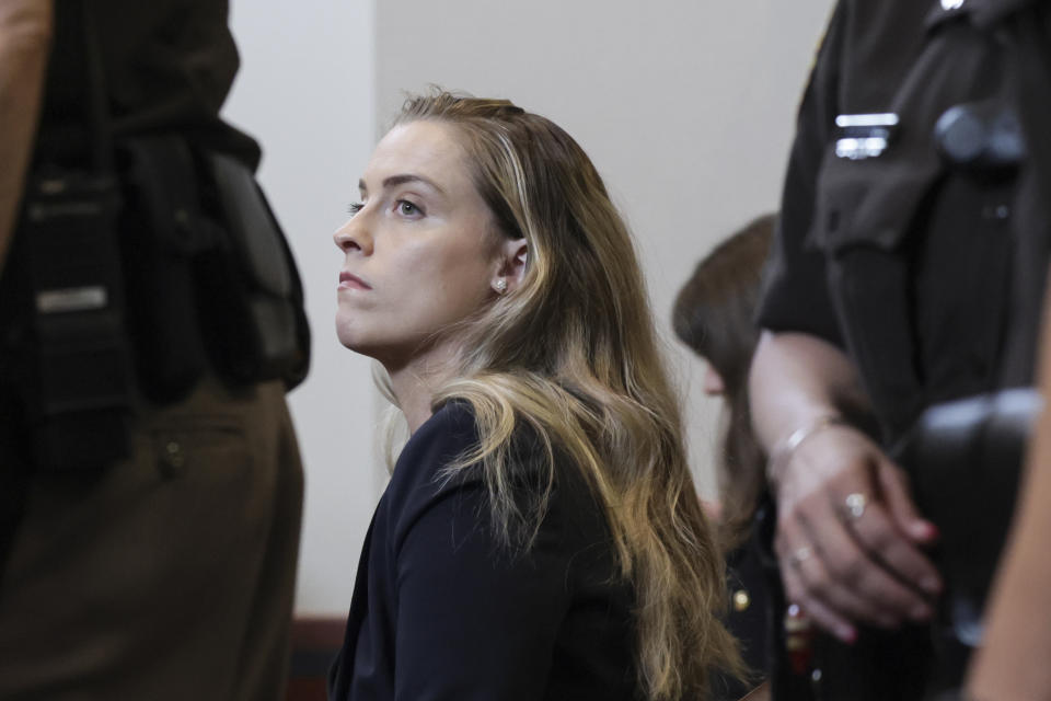 Whitney Henriquez, sister of actor Amber Heard, sits in the courtroom at the Fairfax County Circuit Courthouse in Fairfax, Va., Wednesday, May 25, 2022. Actor Johnny Depp sued his ex-wife Amber Heard for libel in Fairfax County Circuit Court after she wrote an op-ed piece in The Washington Post in 2018 referring to herself as a "public figure representing domestic abuse." (Evelyn Hockstein/Pool photo via AP)