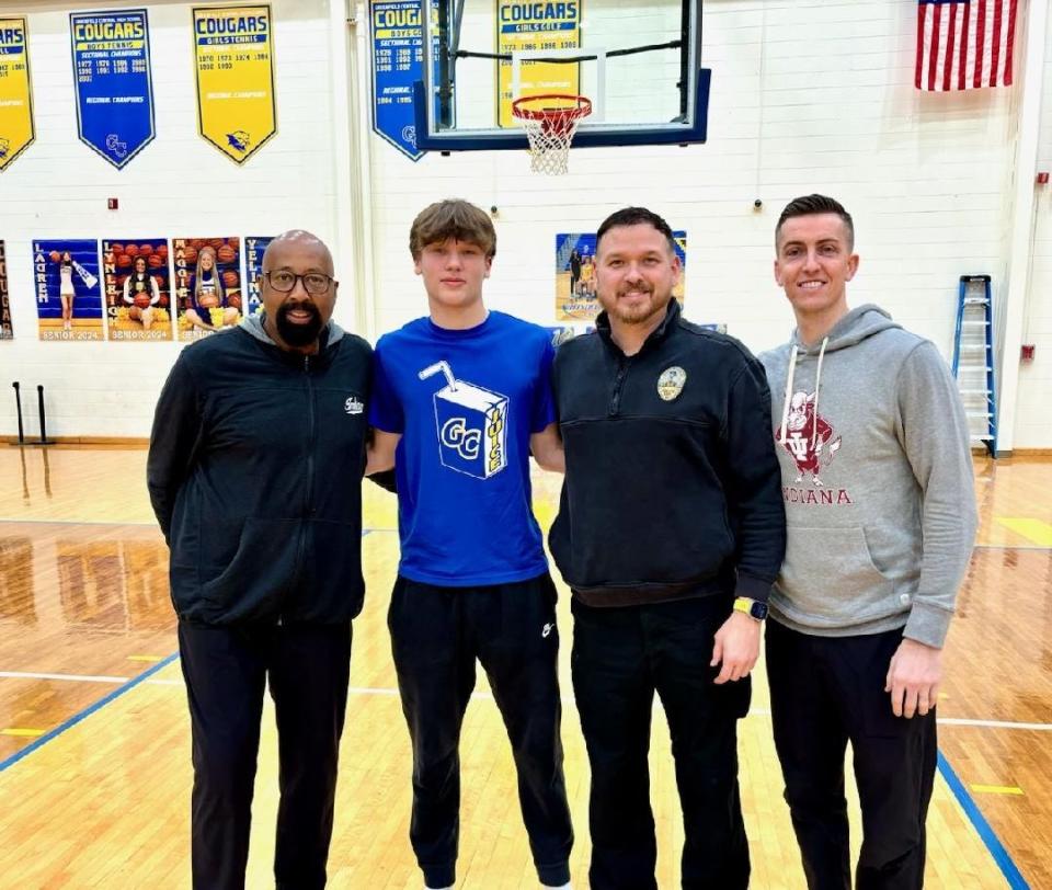 Indiana coach Mike Woodson visited Greenfield-Central junior Braylon Mullins on Wednesday. From left: Woodson, Braylon Mullins, Josh Mullins, IU assistant Brian Walsh