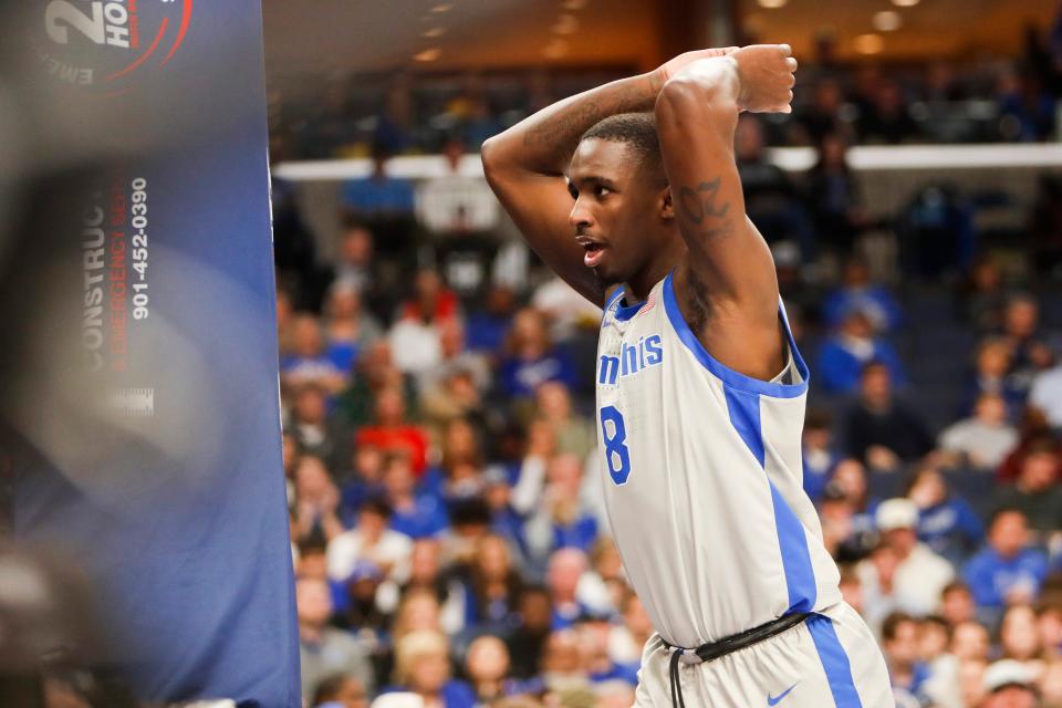 Memphis' David Jones (8) hits the basket in reaction to a call from a referee during the game between Vanderbilt University and University of Memphis at FedExForum in Memphis, Tenn., on Saturday, December 23, 2023.