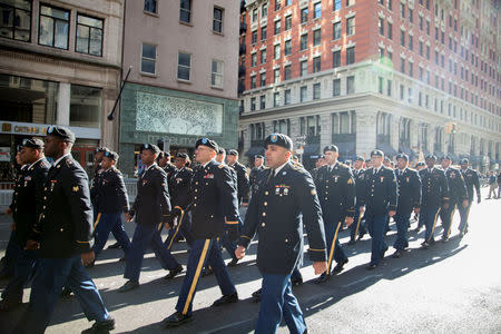 U.S. Army Reserve Soldiers march on Fifth Avenue during the annual New York City Veterans Day Parade in New York, NY, U.S., November 11, 2017. Picture taken November 11, 2017. Hector Rene Membreno-Canales/U.S. Army/Handout via REUTERS