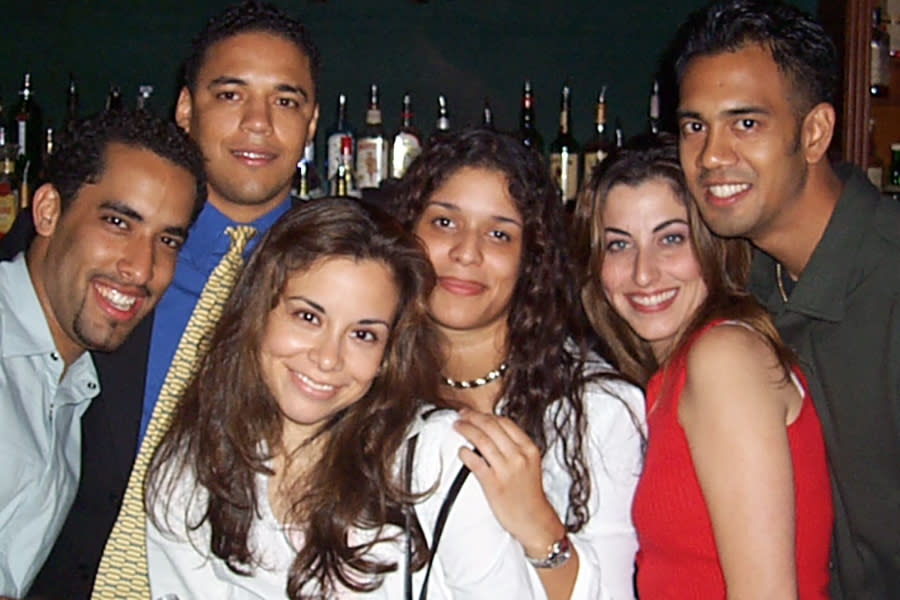 Félix Sánchez, second left, with other young Dominican Americans at Arka Lounge in the Washington Heights neighborhood of New York City on Aug. 29, 2001. (Cid Wilson)