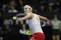 Latvia's Anastasija Sevastova winds up to hit a ball into the stands after defeating United States' Serena Williams in a Fed Cup qualifying tennis match Saturday, Feb. 8, 2020, in Everett, Wash. (AP Photo/Elaine Thompson)