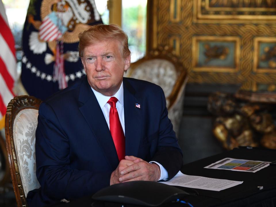 US President Donald Trump answers questions from reporters after making a video call to the troops stationed worldwide at the Mar-a-Lago estate in Palm Beach Florida, on December 24, 2019.