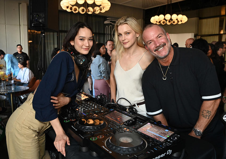 DJ Mona (L) and Director of IMG Models, Aaron Newbill (R) attend as Jessica Stam (center) and WME Fashion host cocktail reception for Maui Wildfire Relief during NYFW: The Shows at Spring Studios on September 12, 2023 in New York City.