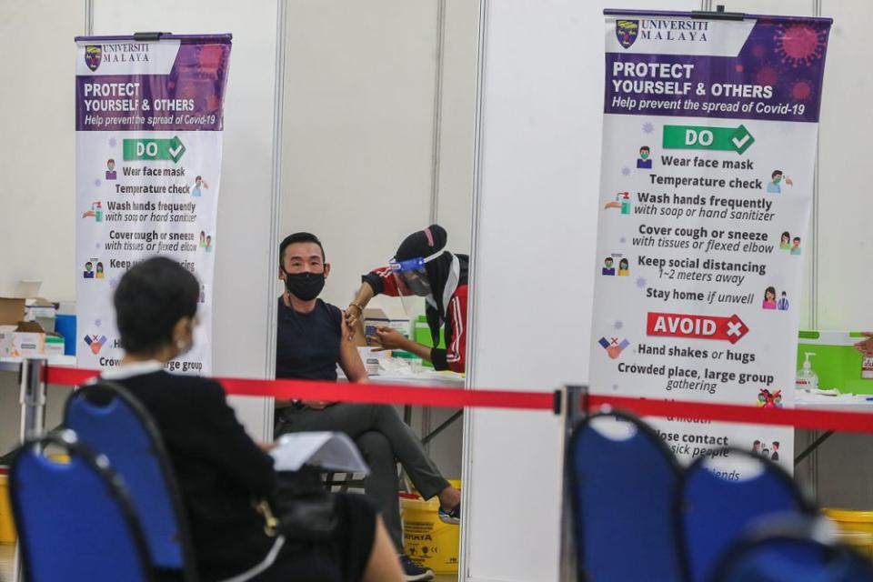 A man receives the AstraZeneca Covid-19 jab at Universiti Malaya, Kuala Lumpur May 5, 2021. — Picture by Yusof Mat Isa