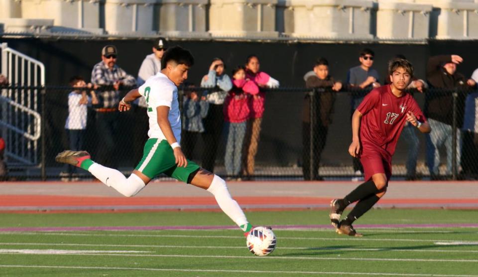 Riverdale High senior Felipe Mora fires the ball past Matilda Torres High defender Ángel Villagomez during the CIF Central Section Division V championship at Madera South on Feb. 24, 2024. Torres won, 1-0. JUAN ESPARZA LOERA/jesparza@vidaenelvalle.com