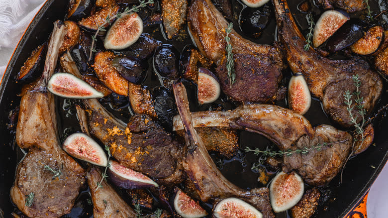 A pan of roasted lamb chops with thyme and figs