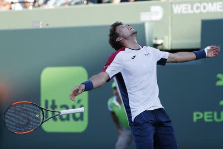 Mar 29, 2018; Key Biscayne, FL, USA; Pablo Carreno Busta of Spain celebrates after match point against Kevin Anderson of South Africa (not pictured) on day ten of the Miami Open at Tennis Center at Crandon Park. Mandatory Credit: Geoff Burke-USA TODAY Sports