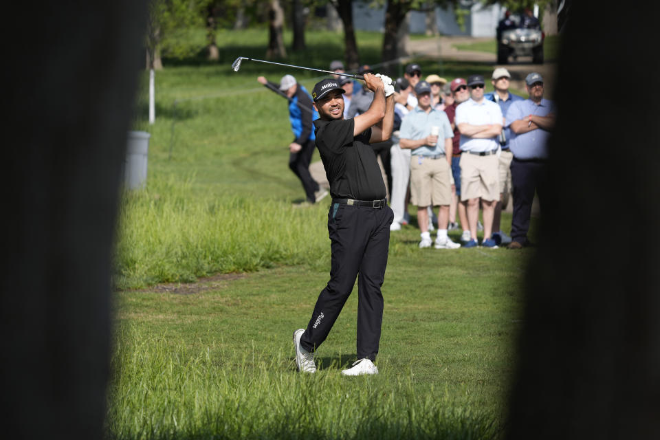 Jason Day hits from the rough on the 10th hole during the first round of the Byron Nelson golf tournament in McKinney, Texas, Thursday, May 2, 2024. (AP Photo/LM Otero)