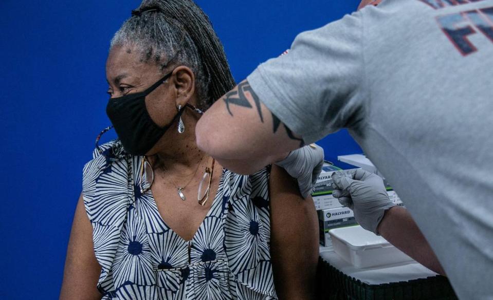 Miami, Florida, January 4, 2021- Peachie Tresbant receives the Pfizer-BioNTech Covid-19 vaccine at the Christine E. Lynn Rehabilitation Center at Jackson Memorial Hospital.