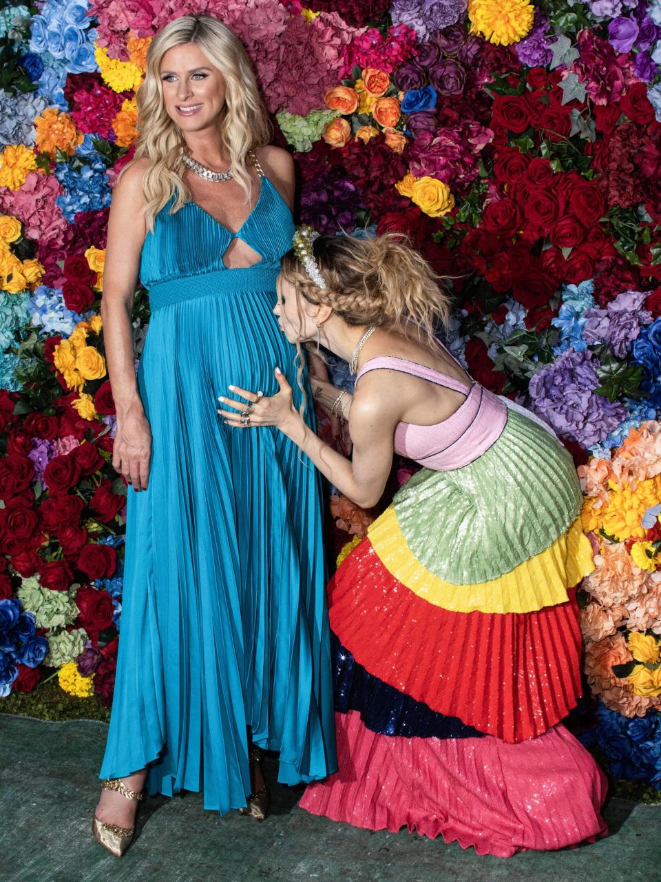 Stacey Bendet kisses Nicky Hilton Rothschild’s stomach at Alice + Olivia’s 20th anniversary celebration at The Close East Lawn in New York City on June 15, 2022. - Credit: Christian Lora/Image Press Agency / MEGA