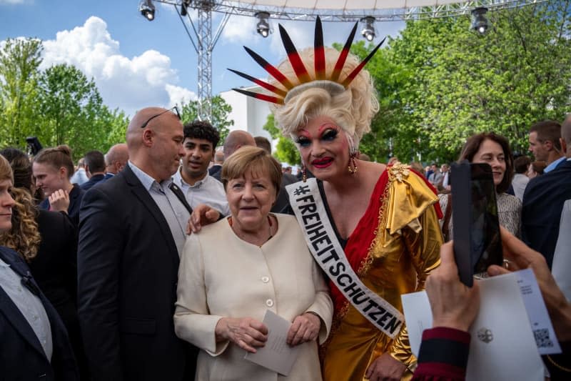 Former Chancellor of Germany Angela Merkel and Drag queen Olivia Jones attend the state ceremony to mark "75 years of the Basic Law" on the forum between the Bundestag and the Federal Chancellery. The Basic Law of the Federal Republic of Germany was promulgated on May 23, 1949 and came into force the following day where the anniversary will be celebrated with a three-day democracy festival from 24 to 26 May 2024 in Berlin's government district. Michael Kappeler/dpa