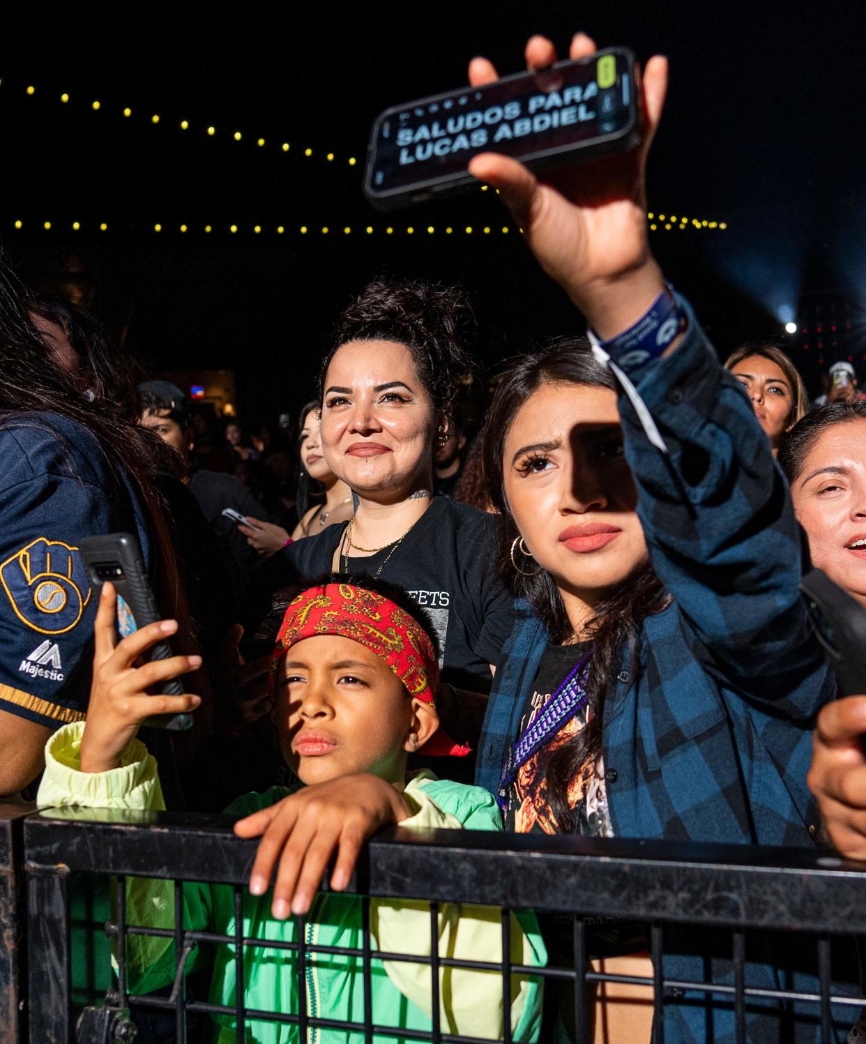 8-year-old Lucas Abdiel joins his sister Lisvet Villanueva as they watch Santa Fe Klan headline Summerfest's Miller Lite Oasis on Saturday, June 24, 2023. This has been a major year for big Mexican music stars coming into the city, including Los Bukis on Aug. 24, and Peso Pluma Sept. 14.