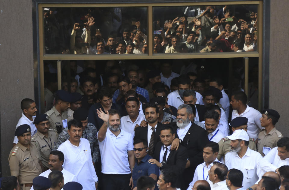 India's opposition Congress party leader Rahul Gandhi waves to his supporters as he leaves the court in Surat, India, Monday, April 3, 2023. An Indian court on Monday suspended a two-year prison sentence for Indian opposition leader Rahul Gandhi as he appeals a criminal conviction for mocking the prime minister's surname that saw him expelled from Parliament, dealing a huge blow to his Congress Party ahead of general elections next year. (AP Photo)