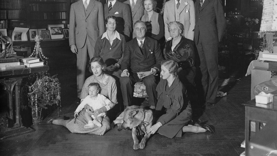 In this photo, made on Christmas day, 1932, President Franklin D. Roosevelt is shown with his family, including Major, the family dog. - Bettmann Archive/Getty Images