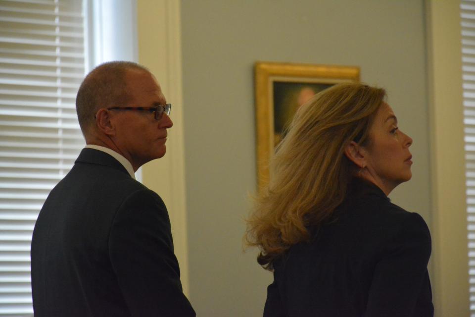 Cory Fleming, at left, with defense attorney Deborah Barbier, stands in the Hampton County Courthouse Friday for a status conference hearing on his criminal charges.