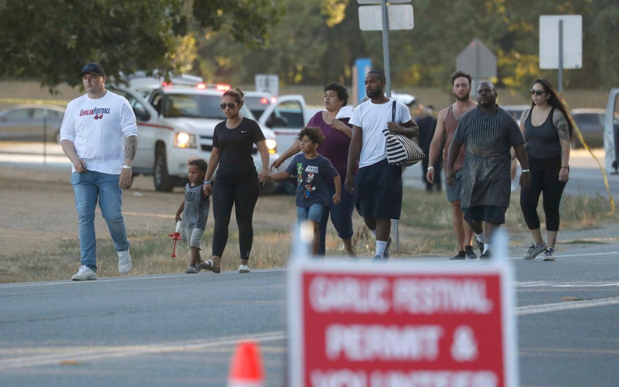 People leave the Gilroy Garlic Festival following a deadly shooting - San Jose Mercury News