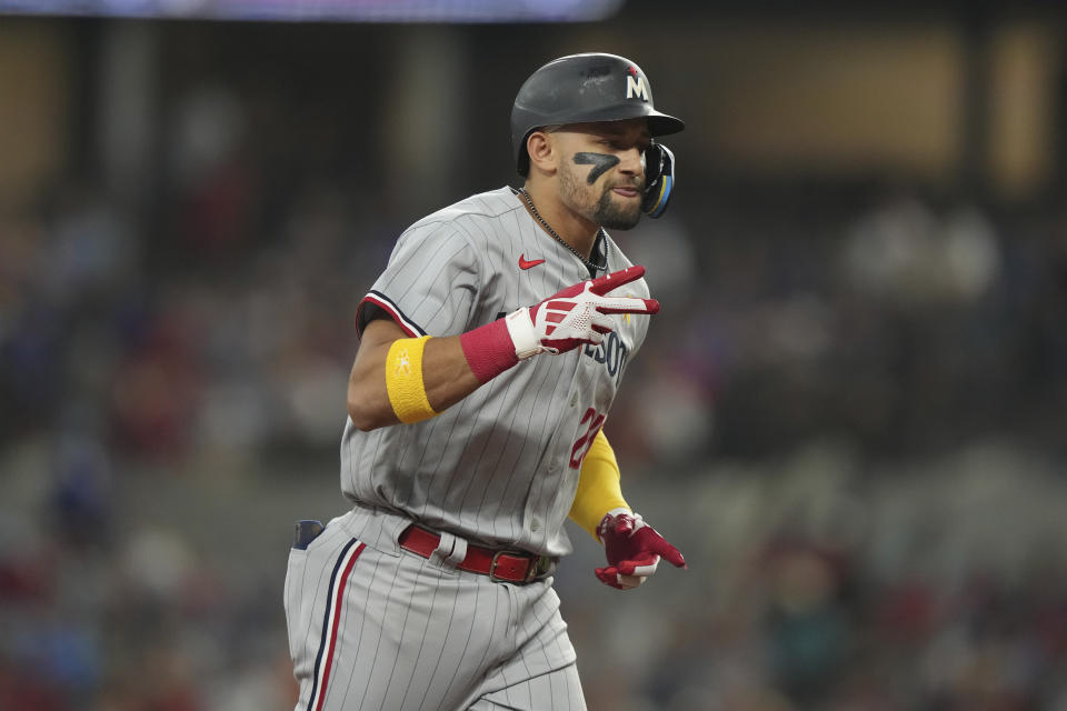 Minnesota Twins' Royce Lewis runs the bases after hitting a home run during the fifth inning of a baseball game against the Texas Rangers in Arlington, Texas, Sunday, Sept. 3, 2023. (AP Photo/LM Otero)