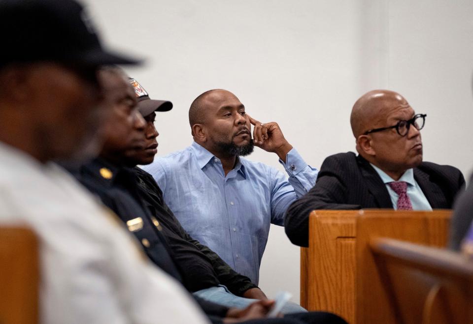 Riviera Beach councilman Douglas Lawson, center, and Richard Ryles listen to West Palm Beach Police Chief Adderley during a town hall meeting at New Bethel Missionary Baptist Church in West Palm Beach, Florida on January 31, 2023.