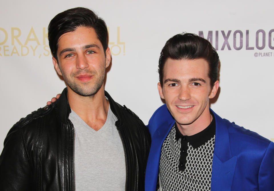 Josh Peck, left, supports Drake Bell at Bell’s album release party on April 17, 2014, in L.A. (Photo: Paul Archuleta/FilmMagic)