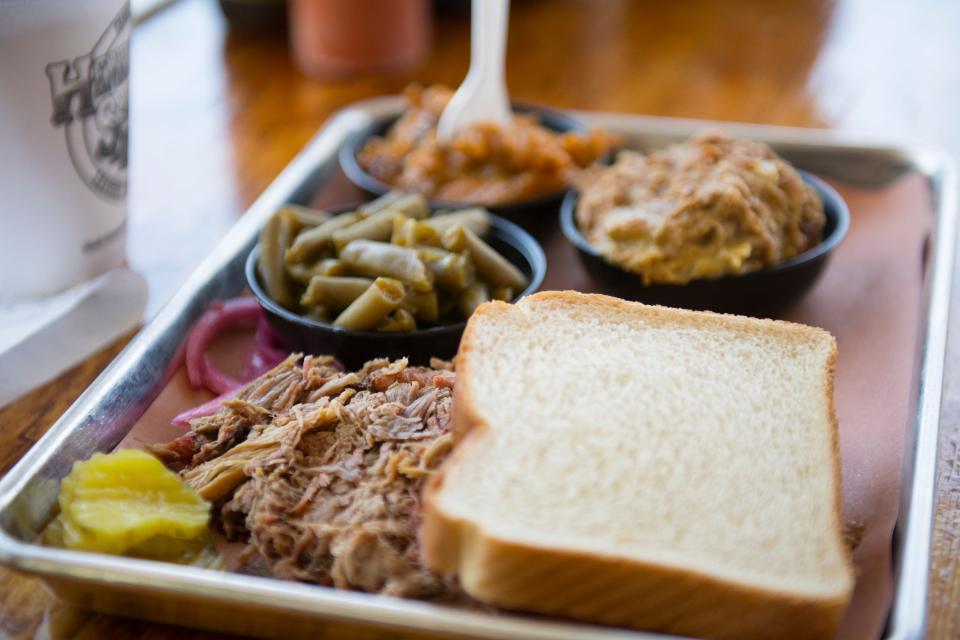 A tray of pulled pork sits on a table at Henry's Smokehouse on Thursday, April 19, 2018. 