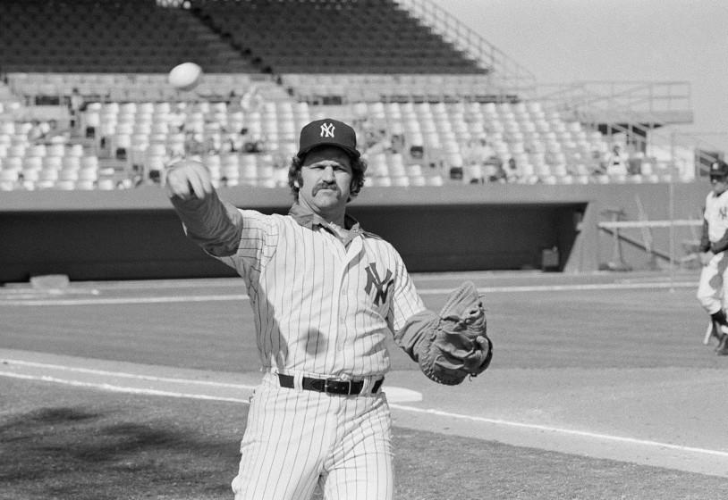 New York Yankees catcher, Thurman Munson, reports to spring training camp, Feb. 24, 1978 in Ft. Lauderdale and limbers up his throwing arm during workouts. (AP Photo/Robert H. Houston)