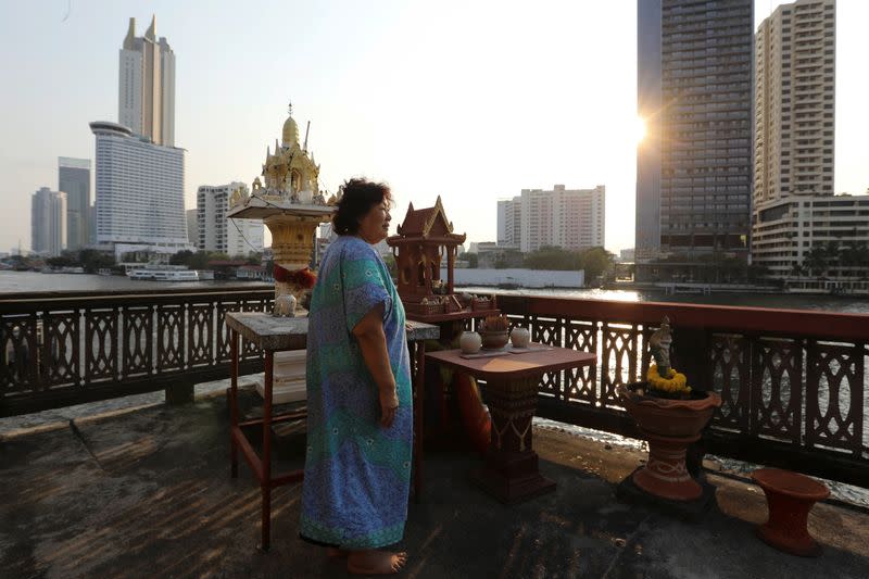 The Wider Image: In old Bangkok, a goddess resists a wave of gentrification