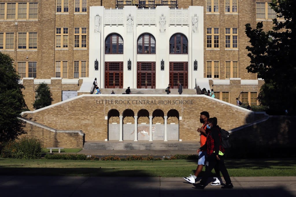 Students make their way into Little Rock Central High School on Monday, Aug. 24, 2020, for the first day of classes in the Little Rock School District. (Tommy Metthe/Arkansas Democrat-Gazette via AP, FIle)