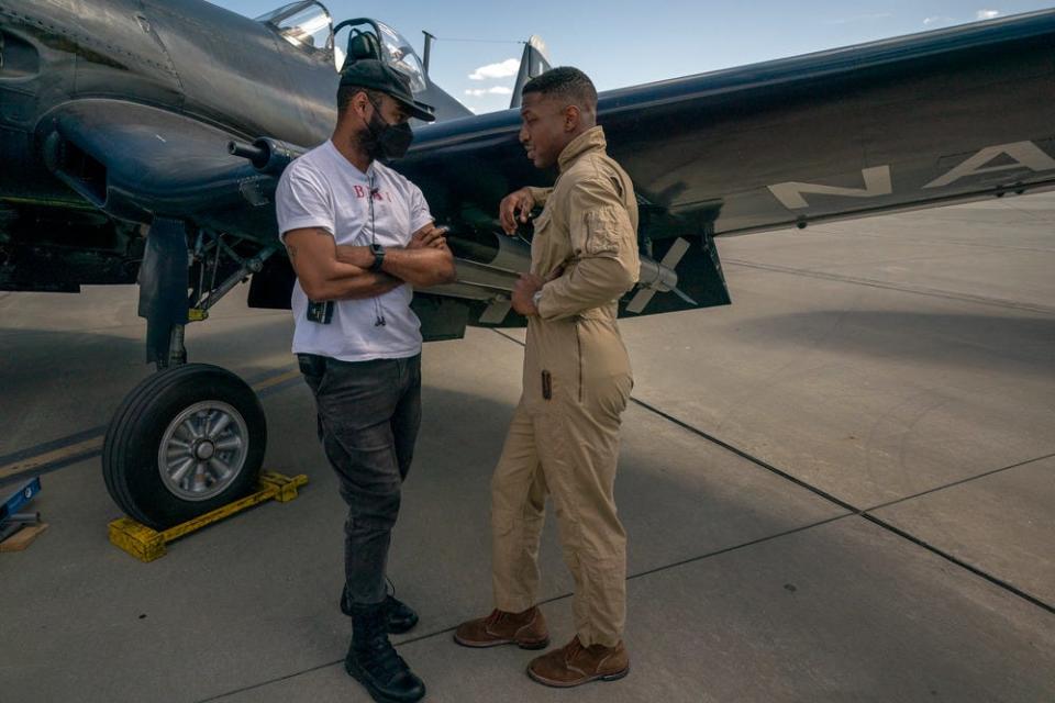 Director J.D. Dillard speaks with Jonathan Majors on the set of Columbia Pictures’ "Devotion."