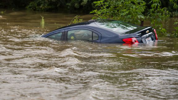 A vehicle is submerged in floodwaters in Youngsville, La. Louisiana Gov. John Bel Edwards declared a state of emergency Saturday, calling the floods “unprecedented” and “historic.”