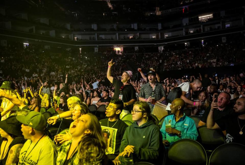 Fans cheer as DJ Drama takes the stage during Snoop Dogg’s High School Reunion Tour at Sacramento’s Golden 1 Center on Friday, Aug. 25, 2023, with Wiz Khalifa, Too $hort, Warren G and Berner.